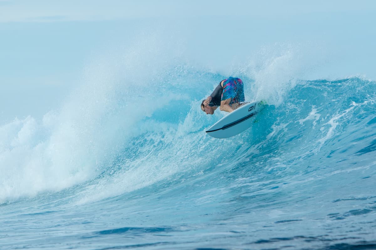 Brad surfing a wave in Fiji