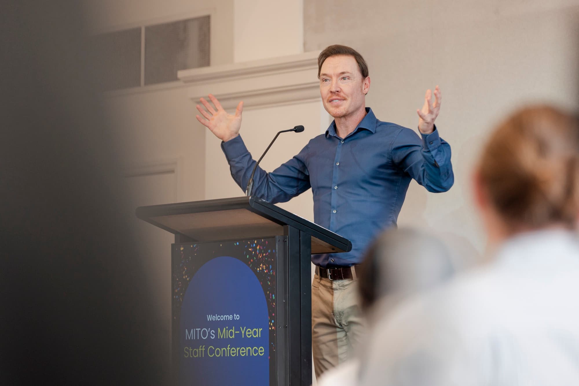 Brad Hook speaking on a conference stage