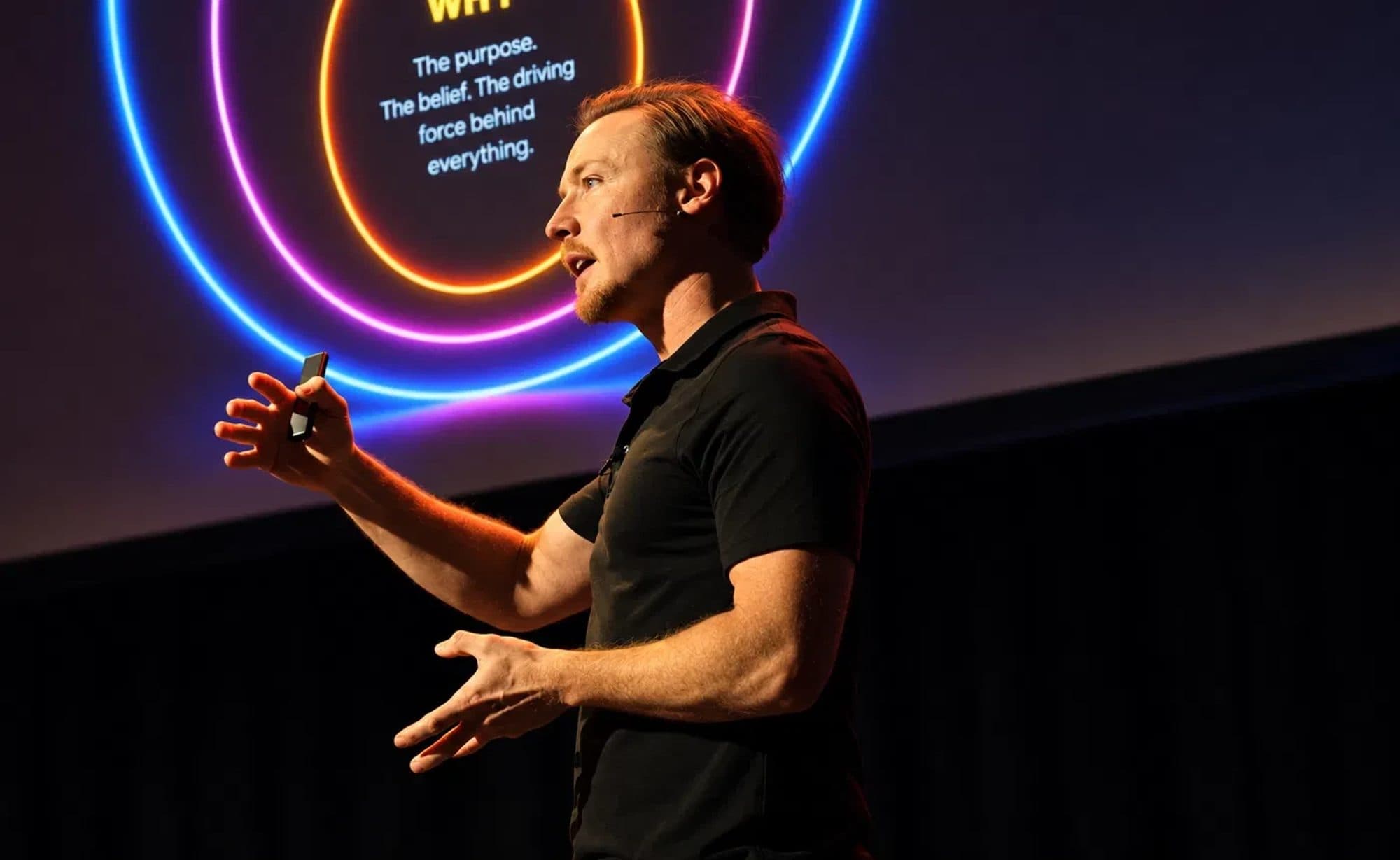 Brad Hook on stage, presenting the why behind the FLAME method